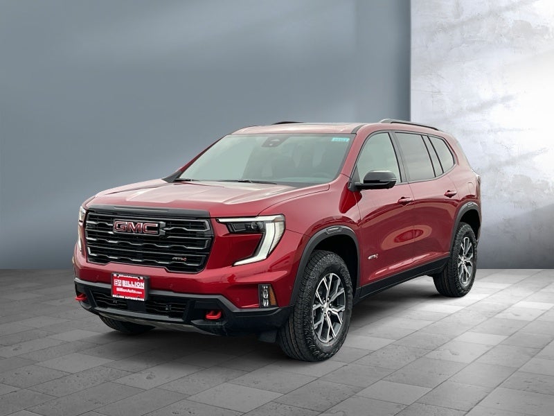 2026 GMC Acadia AT4 in Volcanic Red Tintcoat — front three-quarter view
