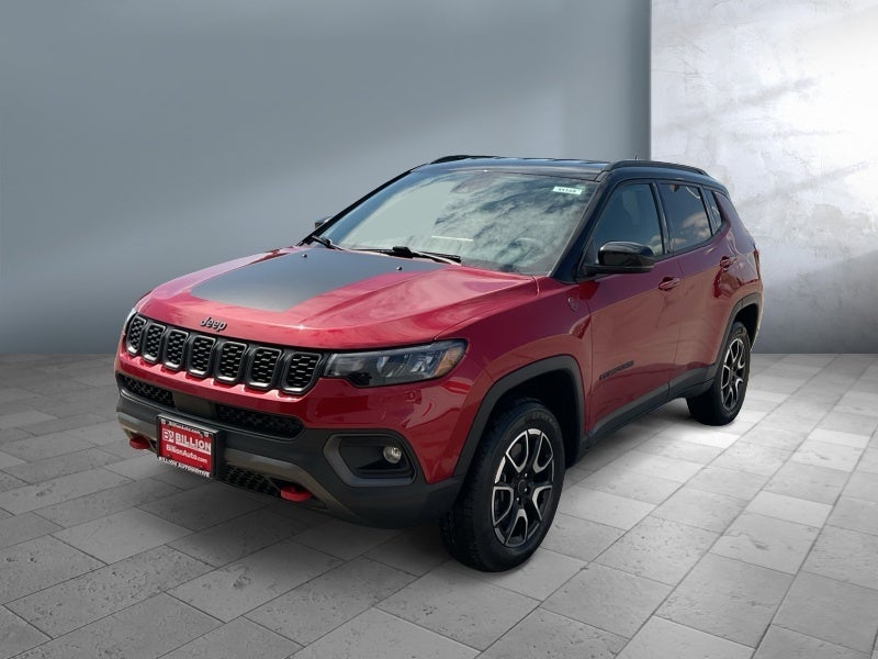 2025 Jeep Compass Trailhawk in Red — front three-quarter view